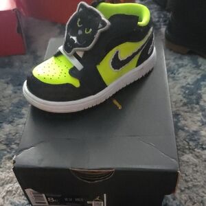 Nike Black and Green Sneakers with Bold Design